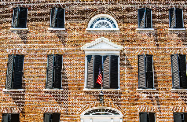 istock American Flag on Old Brick Building 1053657902