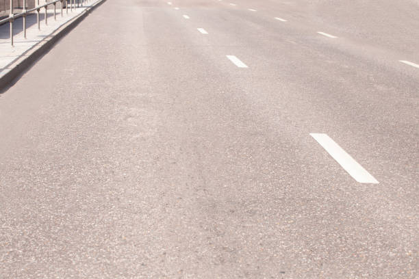 istock Straight road with white markings. 1053667128