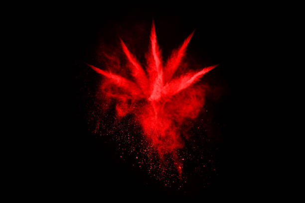 istock abstract red powder explosion on black background.abstract red powder splatted on black background. Freeze motion of red powder exploding. 1053667458