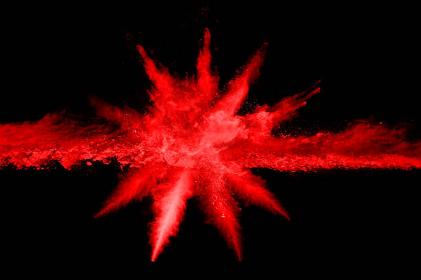 istock abstract red powder explosion on black background.abstract red powder splatted on black background. Freeze motion of red powder exploding. 1053667460