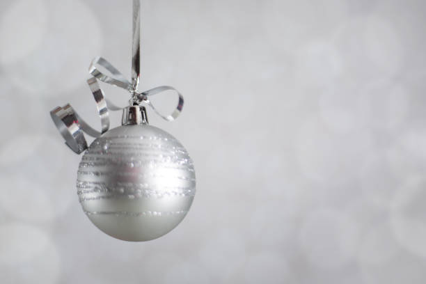 istock Silver Christmas ball with ribbon 1053667592