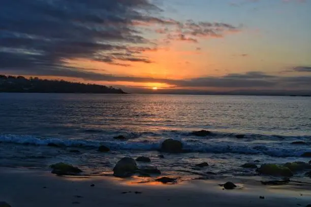 Sunset over the water, the last few minutes of daylight, tonight’s sunset from the beautiful White Beach on the Tasman Peninsula. Tasmania Australia