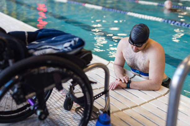 istock Adaptive athlete prepares to swim in a pool 1053672044