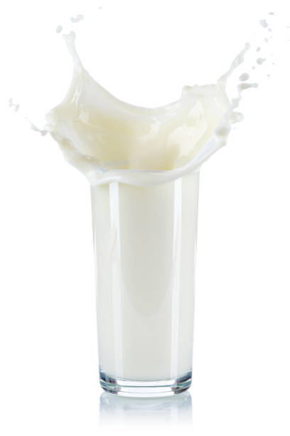 istock Milk splash splashing glass isolated on white 1053689792