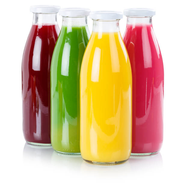 istock Fruit juice in a bottle isolated on white 1053690876