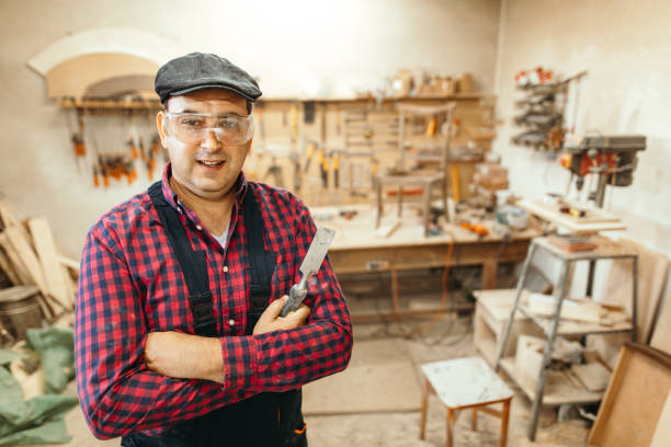 istock Young carpenter restoring old furniture 1053695818