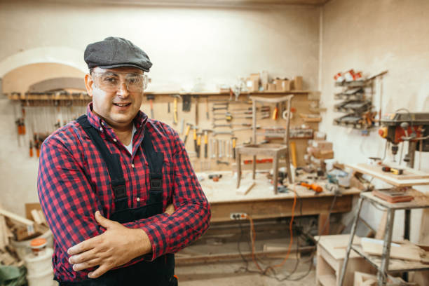 istock Young carpenter restoring old furniture 1053696058