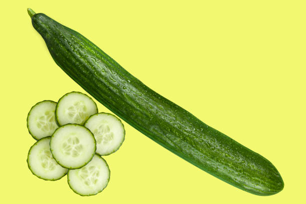 istock Whole cucumber aside a pile of slices 1053704414