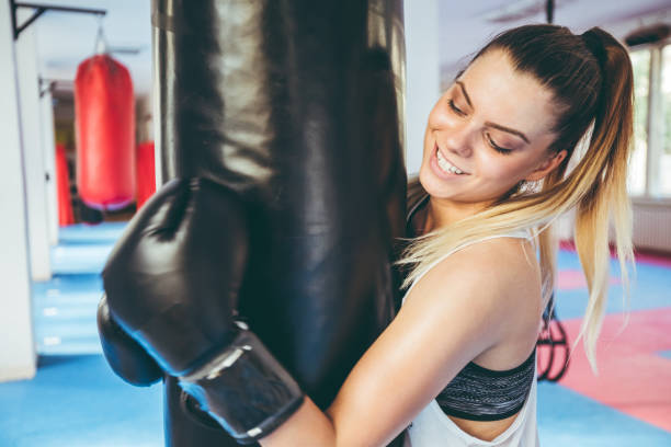 istock Woman boxing in gym 1053704670