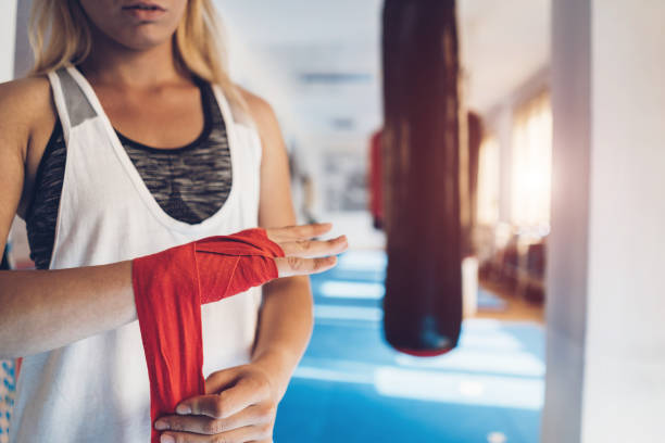 istock Woman boxing in gym 1053705746
