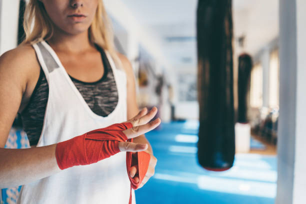 istock Woman boxing in gym 1053706776