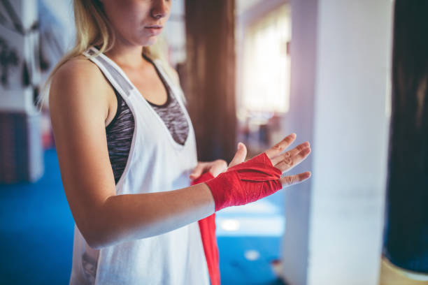 istock Woman boxing in gym 1053710732