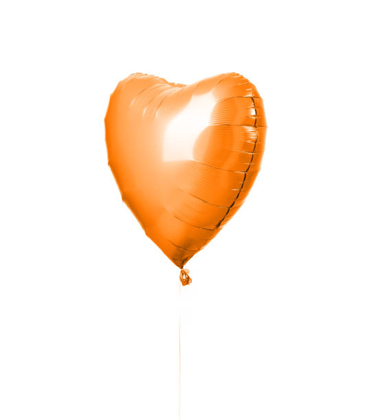 istock Single big  orange heart balloon object for birthday party isolated on white 1053710824