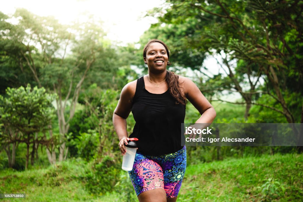 Body positive woman exercising in nature Brazilian woman body positive exercising in nature. Exercising Stock Photo