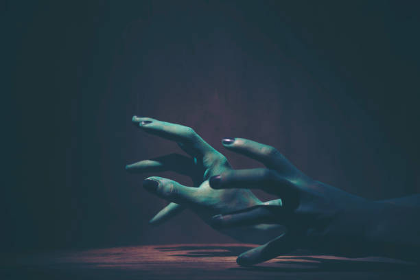 istock Green hand of the ghost on Halloween 1053713992