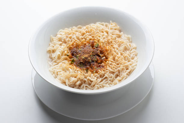 istock noodle in bowl on white background top view 1053718028