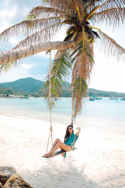 istock Young woman relaxing on the Koh Phangan sandy beach 1053720704