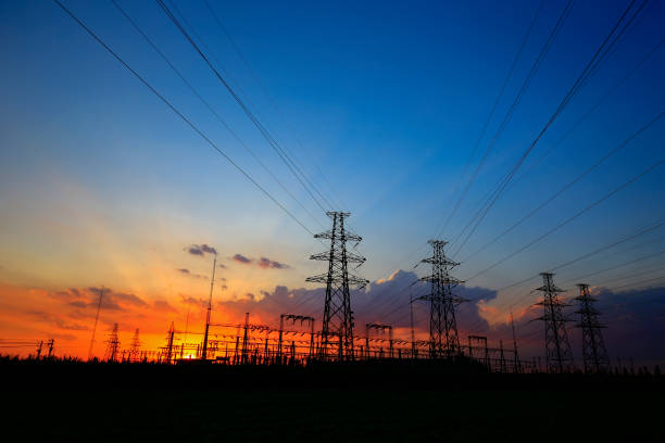 istock Electric tower, silhouette at sunset 1053721792