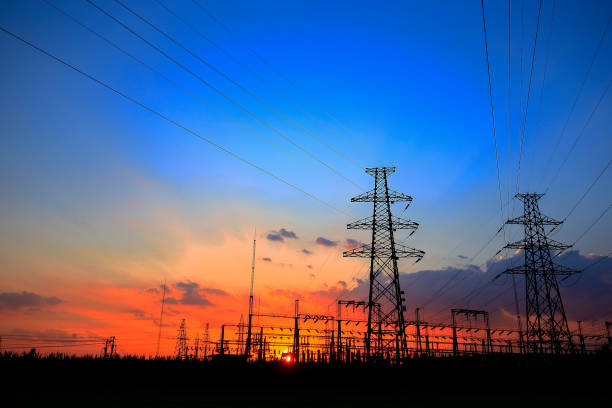 istock Electric tower, silhouette at sunset 1053721798