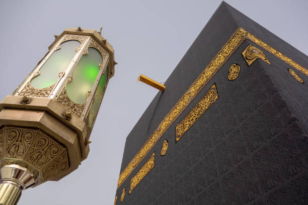 Close up of Kaaba with one of the lights. Low angle view of Kaaba in Mecca, Saudi Arabia. haji stock pictures, royalty-free photos & images