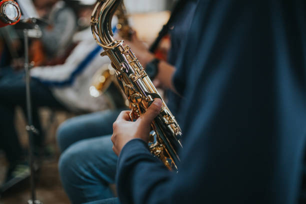 istock Midsection Of Saxophonist Playing Saxophone 1053738856