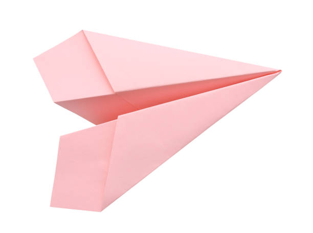 The pink paper plane on a white background stock photo