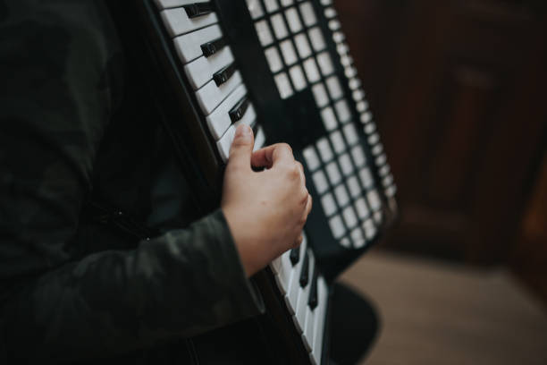istock Midsection Of Man Playing Accordion 1053743172