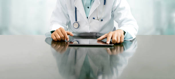 istock Doctor with tablet computer at hospital office. 1053745536