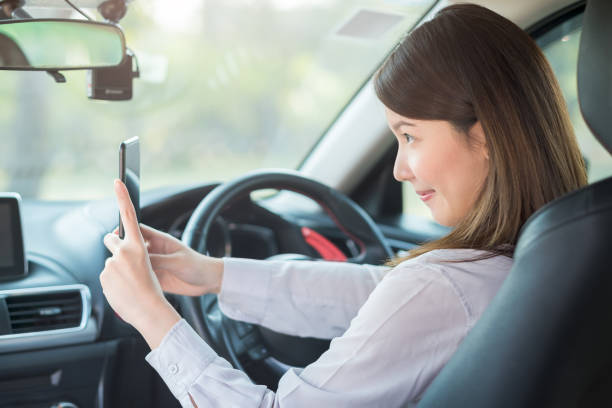 istock Young woman making selfie herself in a car 1053745966