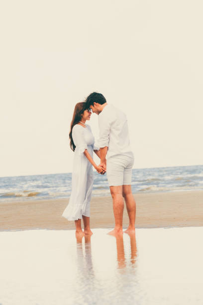 istock Couple going honeymoon on tropical beach in summer 1053748652