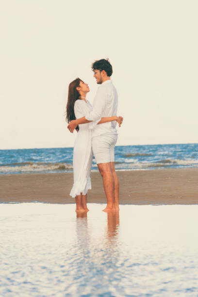 istock Couple going honeymoon on tropical beach in summer 1053748718