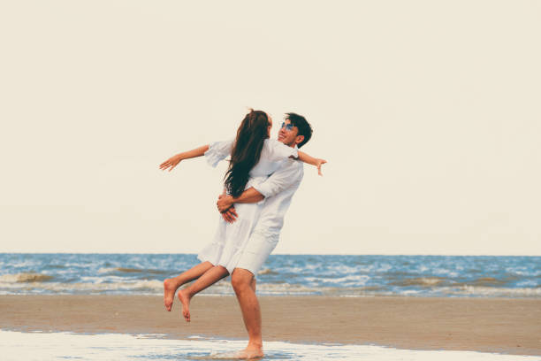 istock Couple going honeymoon on tropical beach in summer 1053748750