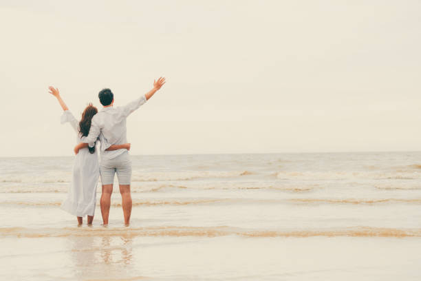 istock Couple going honeymoon on tropical beach in summer 1053748942