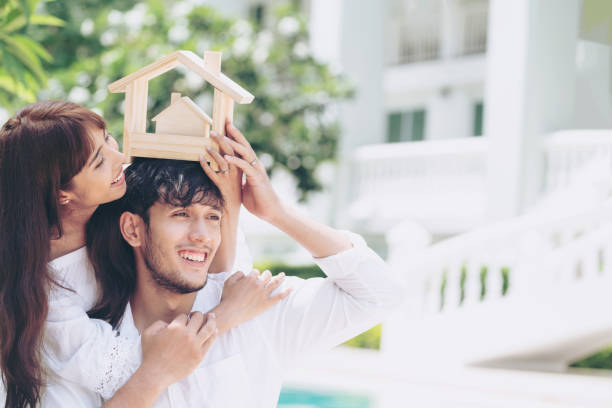 istock Young couple planning to buy a house concept. 1053749092