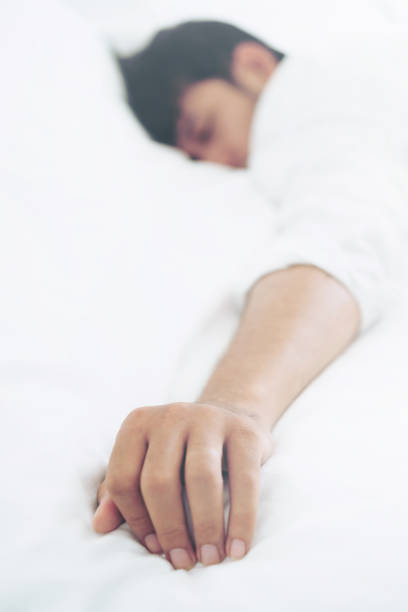 istock Young man sleep in bed in the bedroom. 1053749310