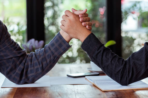 istock Cropped Image Of Colleagues Holding Hands 1053749488