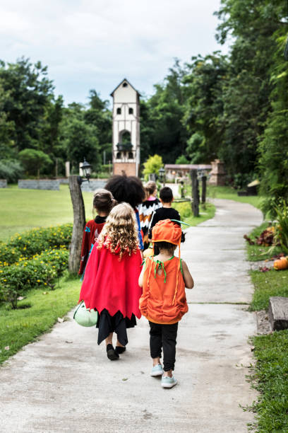 istock Young kids trick or treating during Halloween 1053749612