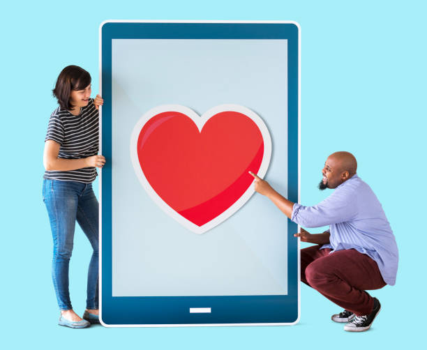 istock Diverse couple of people holding a tablet 1053752002