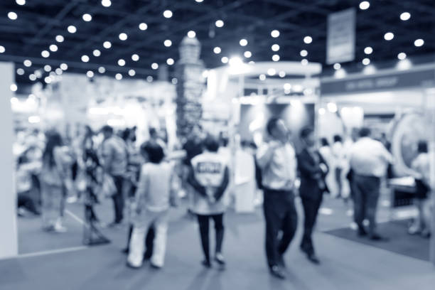 istock Abstract blurred event exhibition with people background, business convention show concept 1053753362
