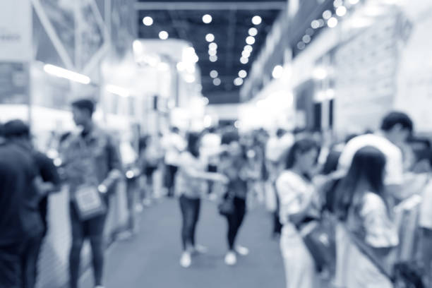istock Abstract blurred event exhibition with people background, business convention show concept 1053753372