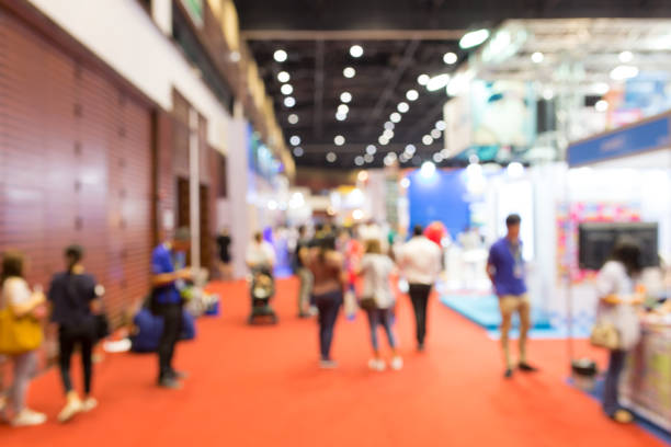 istock Abstract blurred event exhibition with people background, business convention show concept 1053753376