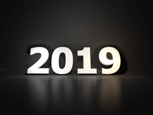 istock White 2019 New Year symbol over black background 1053755582