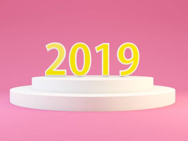 istock 2019 New year symbol on white pedestal over pink background 1053756082