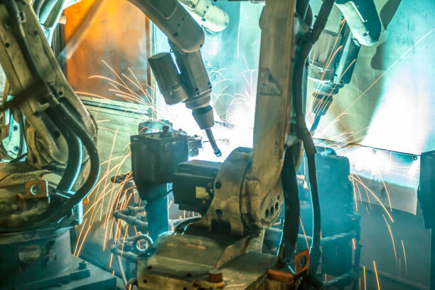 istock Welding robots movement in a car factory 1053758904