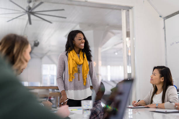 istock Black female CEO leads a team meeting 1053758980