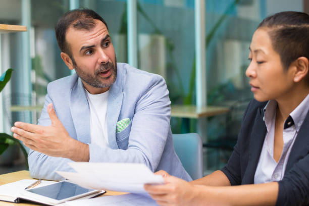 istock Shocked Hispanic male manager explaining business strategy 1053761640