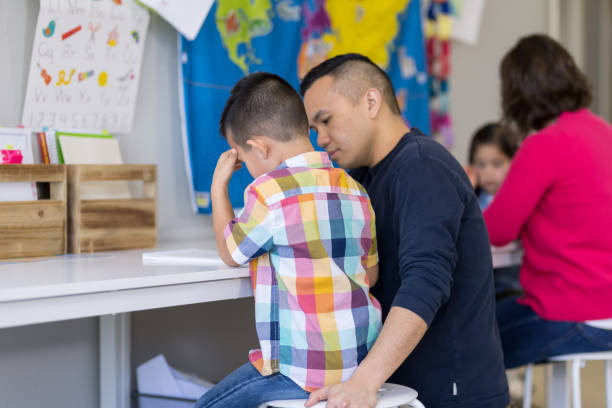 istock Dad homeschooling his young son 1053762120
