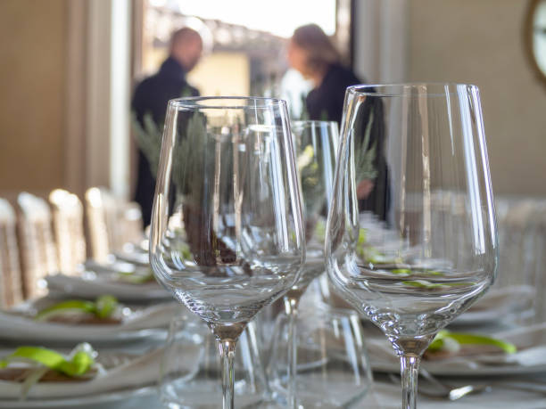 istock Elegant table with white dishes and wedding favors 1053763496