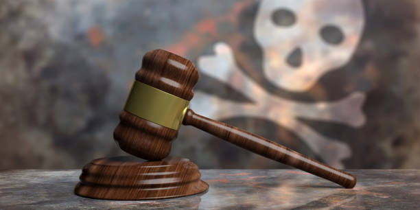 istock Judge or auction gavel on a flag with a skull background. 3d illustration 1053768298