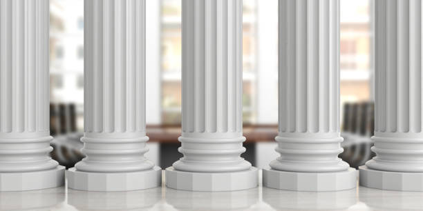 istock Five classical pillars on an office desk, blur background. 3d illustration 1053768360